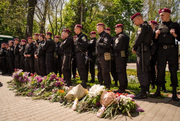 Some put the flowers at the feet of the soldiers blocking the way.